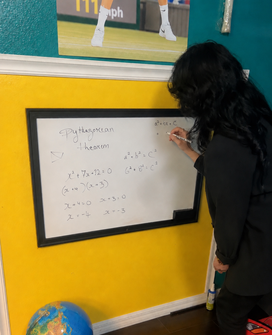Dina evaluating mathematics instruction at a whiteboard